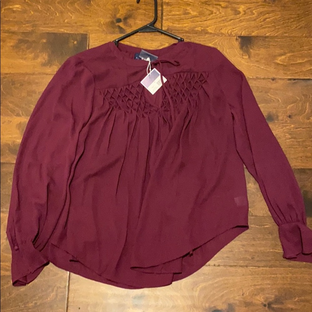 Maroon top. Great for work